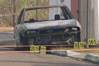 The burned out car in which the dead body was found.
