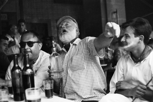 Ernest Hemingway (middle) in a classic pose, drinking in Cuba where he would live in the 50's before the Communist revolution.